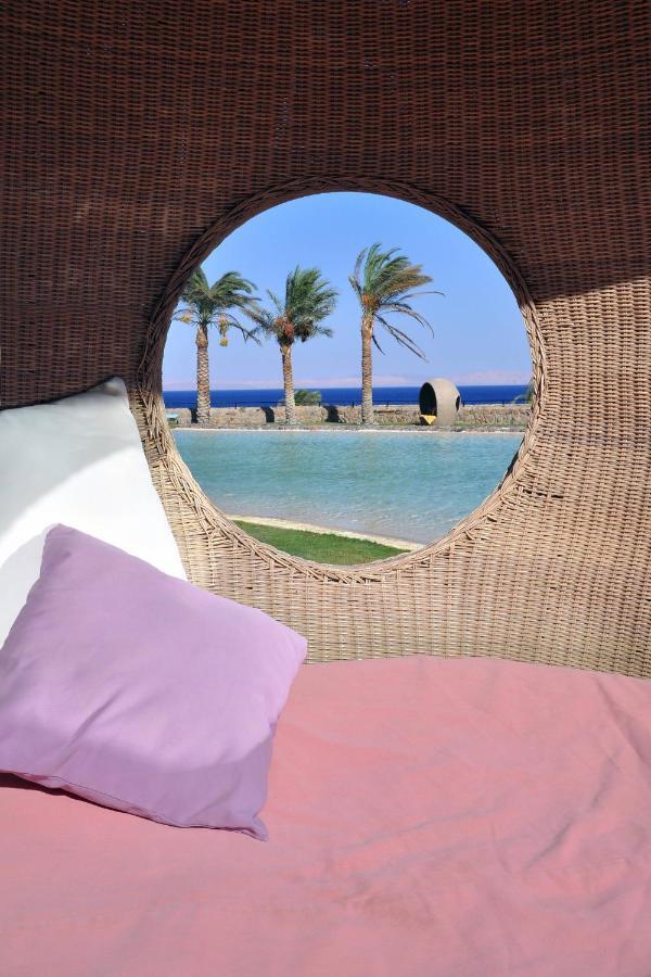 Retac Qunay Dahab Resort & Spa Bagian luar foto View of the pool at the hotel